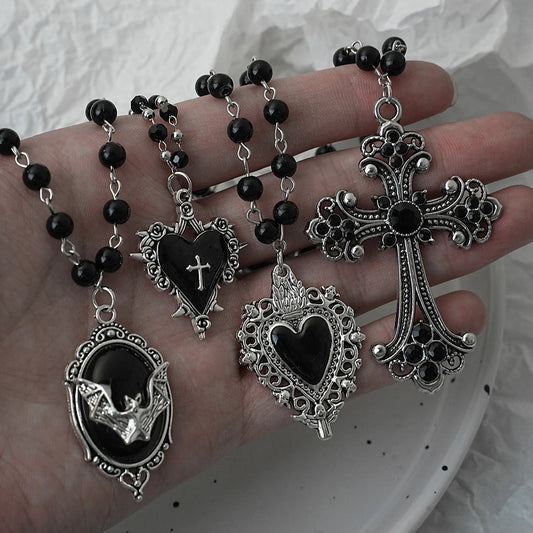 Gothic necklace set with cross and bat pendants, custom dark Y2K style, love necklace with thorns and layered black bead chains, suitable for Halloween.